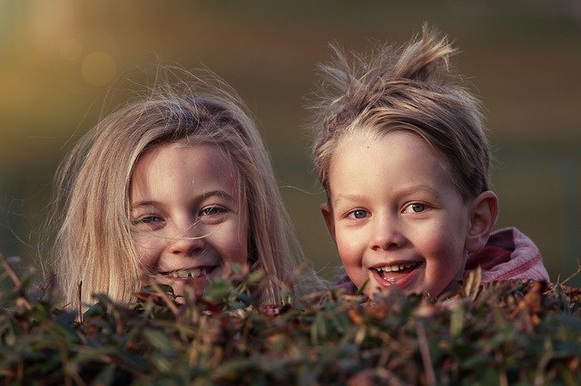 best friends standing together smiling on best friends day
