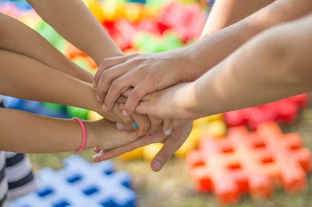 A family gathering everyone holding hands celebrating parents' day